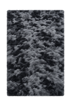 A rectangular shag area rug with a textured, fluffy pile in a mottled pattern of black and gray.